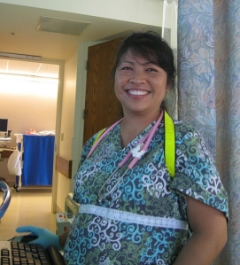 smiling nurse in doorway of hospital room